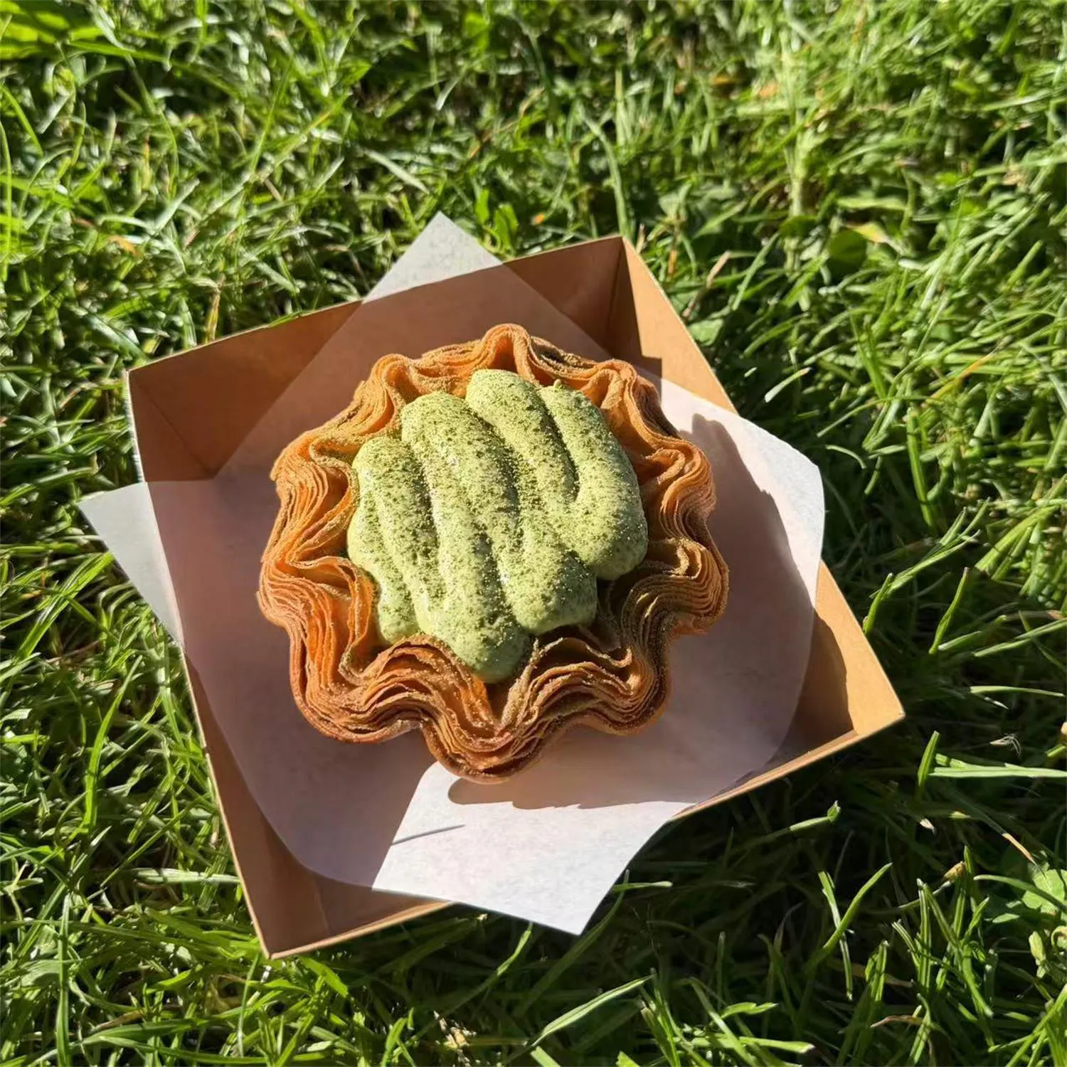 Matcha cream croissant blossom tart at Crescent & Croissant,an Asian-inspired Patisserie in Woodinville