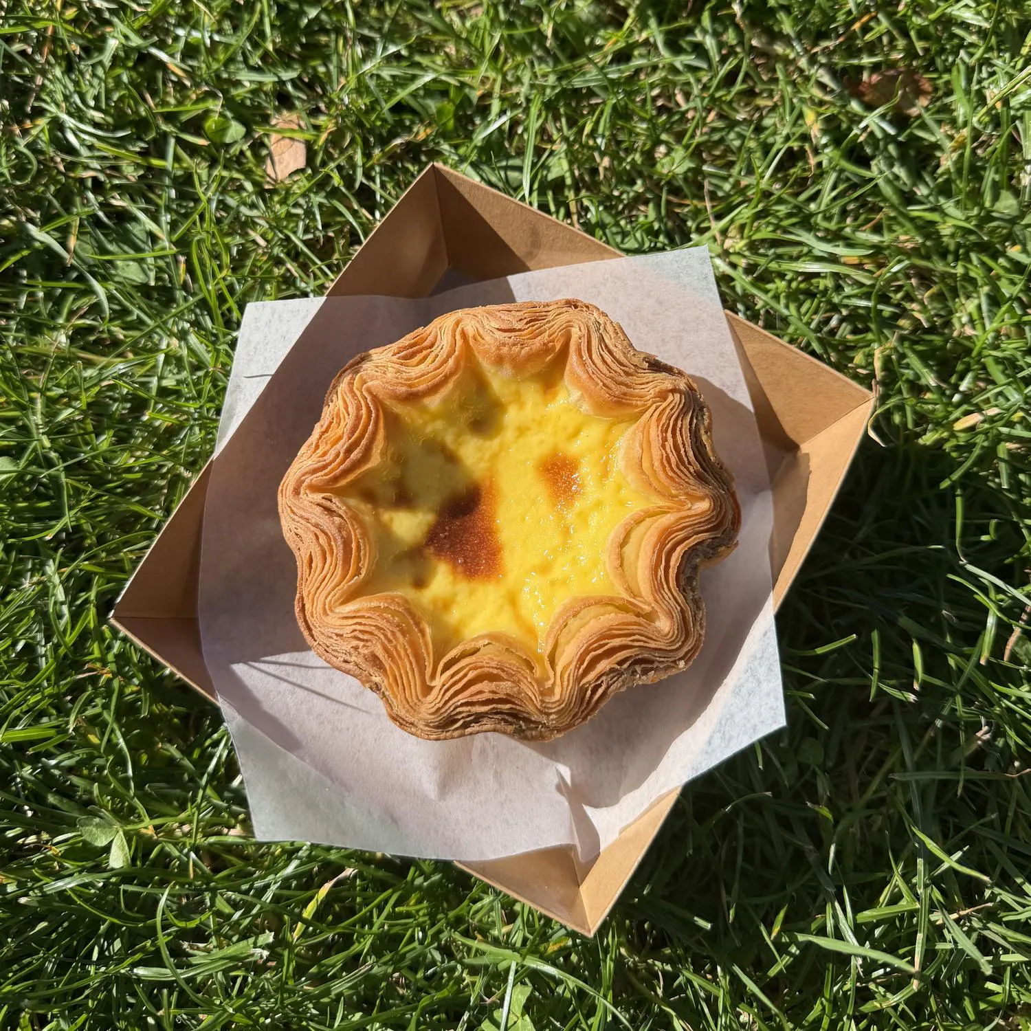 Classic custard croissant blossom tart at Crescent & Croissant,an Asian-inspired Patisserie in Woodinville